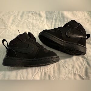 Baby Nike black high top shoes (size is for an infant 2c)